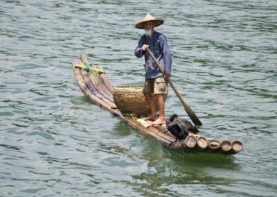 Boatman on the Lijiang River, China